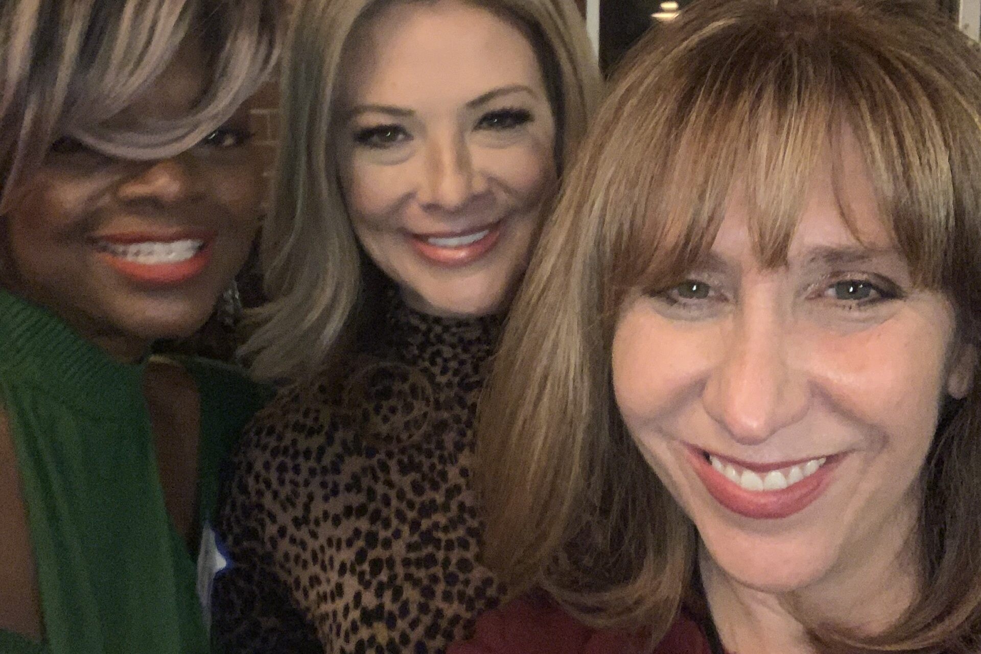 Laurie Berzack smiling with two other women