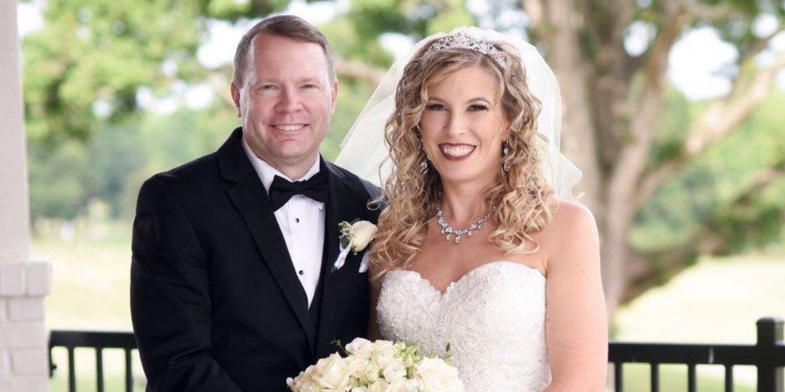 smiling bride and groom