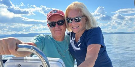 Happy Charlotte couple on a boat in the ocean