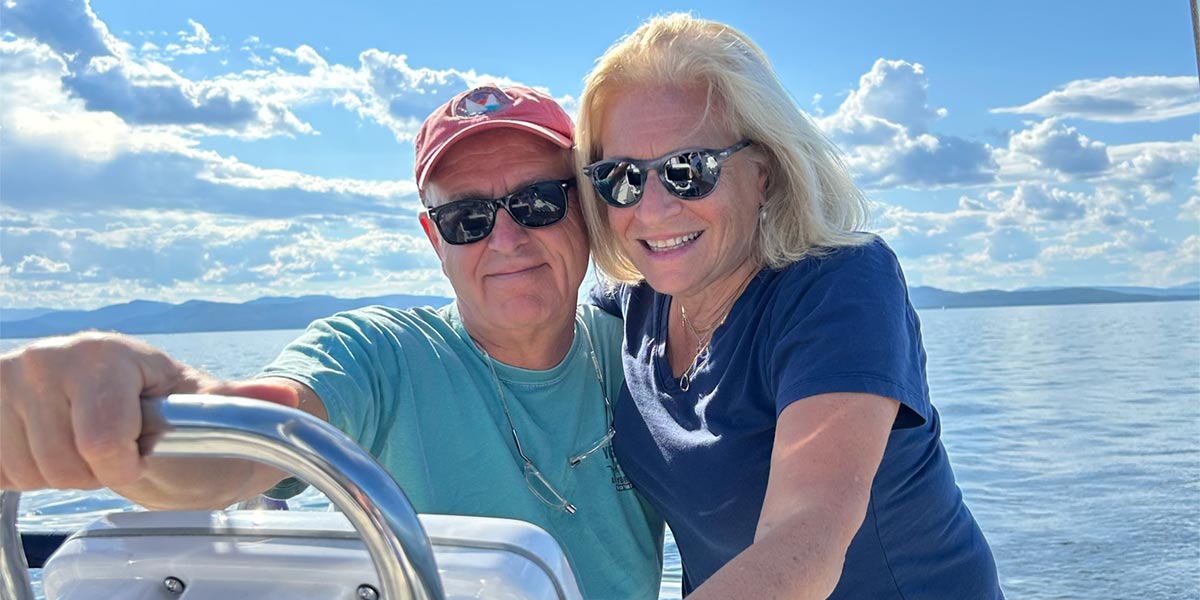 Happy Charlotte couple on a boat in the ocean