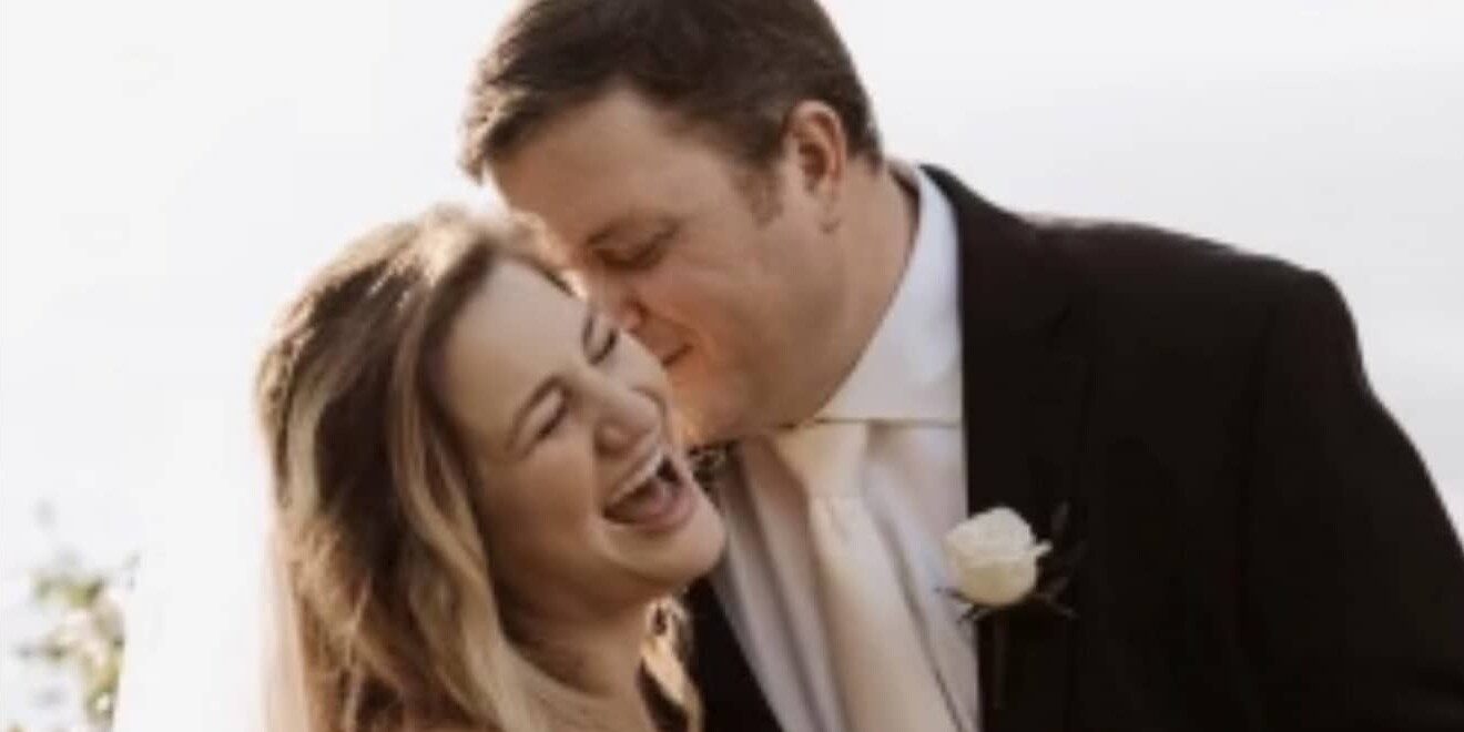 bride and groom laughing